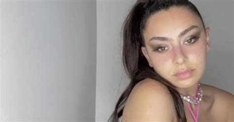 Charli Xcx Begs To Be Buried In Her Bikini As She Spills From Skimpy Two Piece Daily Star