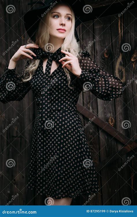 Beautiful Attractive And Stylish Girl Wearing Black Hat Standing Posing In City Nude Makeup