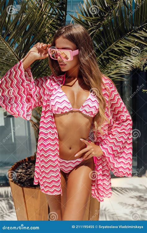 Woman With Blond Hair In Bikini Relaxing In Summer Beach Club Stock Image Image Of Earrings