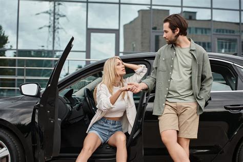 Stylish Man Looking At Seductive Blonde Stock Photo Image Of