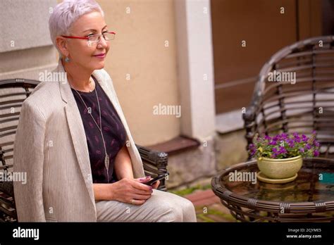 Close Up Portrait Of Awesome Mature Woman Waiting Her Lover Aat The Cafe With Modern Interior