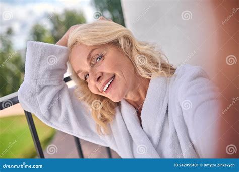 A Blonde Woman In A White Robe Posing For The Photo Stock Image Image