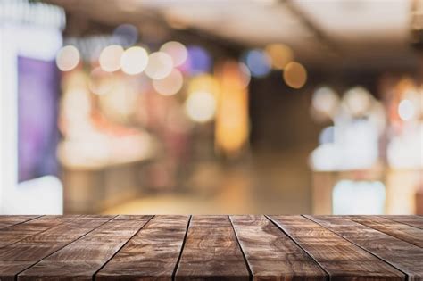 Premium Photo Empty Wood Table Top And Blurred Coffee Shop And