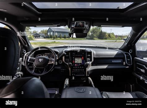 The Interior Of Black 5th Generation Dodge Ram Car With Sunroof Stock