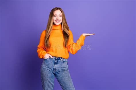 Portrait Photo Of Youth Charming Blonde Hair Cute Happy Smile Girl In Orange Jumper Holding