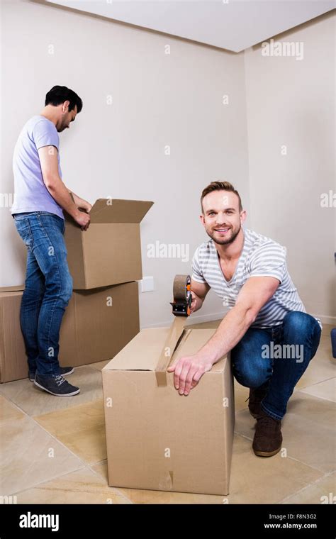 Gay Couple Moving Into New Home Stock Photo Alamy