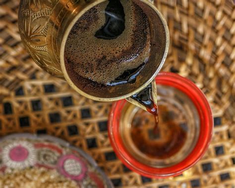Premium Photo | Finjan handmade the coffee is poured into a glass