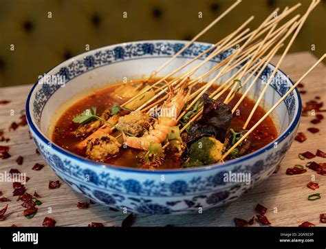 Traditional Chinese Hot Pot Spicy Dish Containing Prawns Tofu Broccoli And Other Vegetables