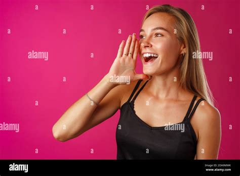 Cute Blonde Woman Screams Using Her Hands As Tube Stock Photo Alamy