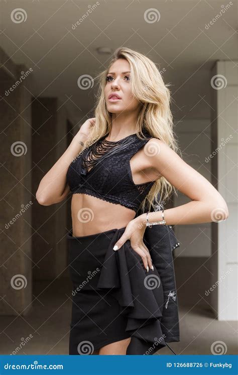 Beautiful Woman With Blonde Hair In Black Clothes Posing Stock Photo Image Of People Pretty
