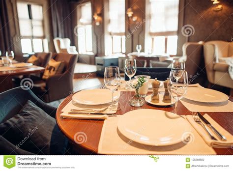 Wooden Design In Classic Restaurant With Glasses On Table Stock Photo