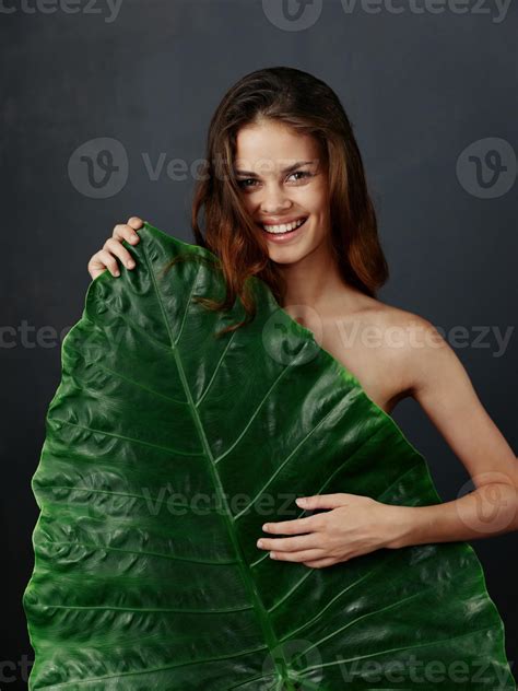 Cheerful Woman Covers Herself With A Green Leaf Naked Body Smile 22004158 Stock Photo At Vecteezy