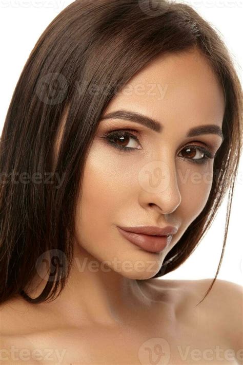 Close Up Portrait Of A Brunette Nude Model Girl With Professional Evening Make Up And Plump Lips