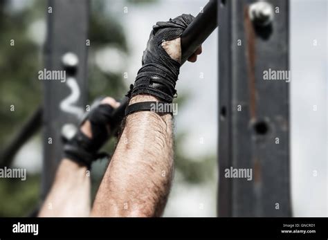 Athlete Doing Exercise On The Horizontal Bar Stock Photo Alamy