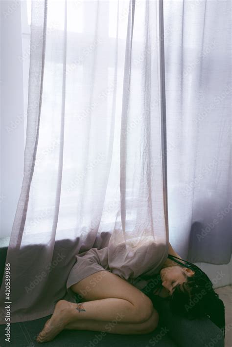 Nude Sad Woman Lying Down On Sofa Stock Photo Adobe Stock