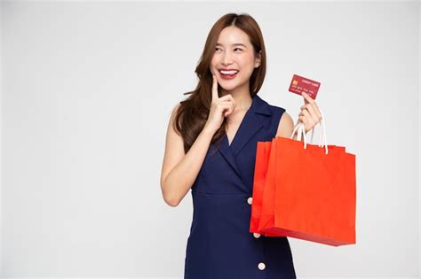 Premium Photo Portrait Of An Excited Beautiful Woman Holding Red