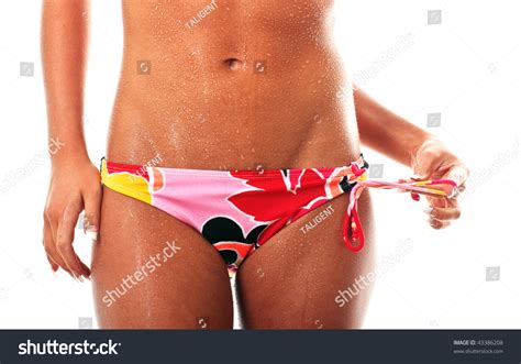 Closeup Of A Beautiful Tanned Stomach In Bikini Stock Photo
