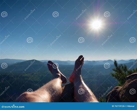 Naked Male Hairy Legs Take Rest On Peak Outdoor Activities In Summer Stock Photo