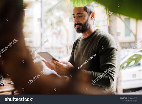 Smiling Mature Man Using Tablet Pc Stock Photo 2268445755 Shutterstock