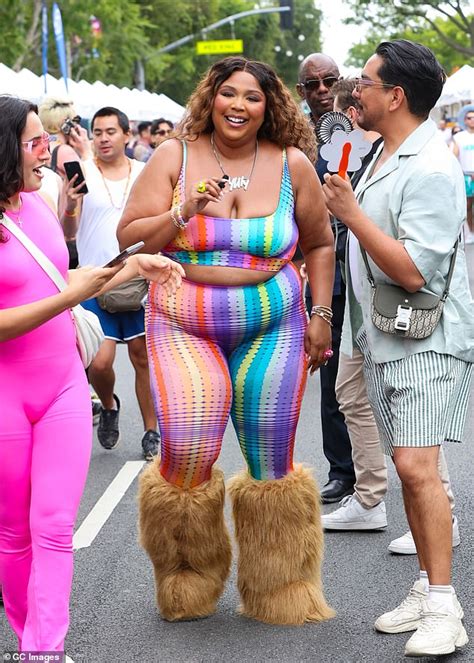 Lizzo Shows Off Her Slimmer Figure As She Gives A Peek At Midriff In Black T Shirt And Matching