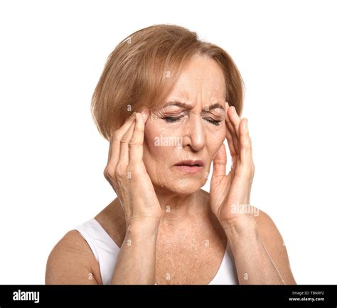 Beautiful Mature Woman Suffering From Head Ache Against White Background Stock Photo Alamy