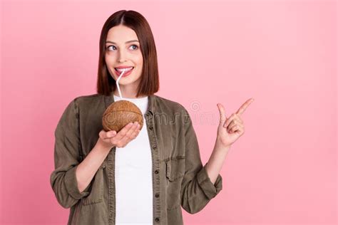 Photo Of Funny Brunette Hairdo Millennial Lady Drink Cocktail Point Look Empty Space Wear Green