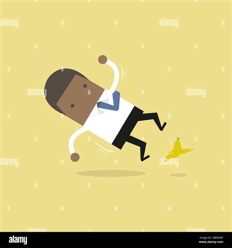 African Businessman Slipping On A Banana Peel And Falling Down Stock