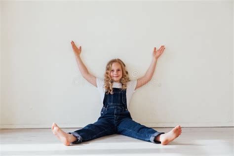 Portrait Of A Beautiful Blonde Girl In A Denim Jumpsuit Stock Photo Image Of Hobby Overalls