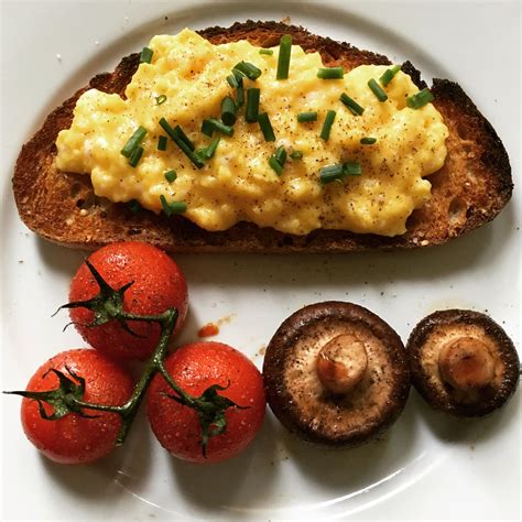 Homemade Breakfast Scrambled Eggs On Multigrain Sourdough Tomatoes