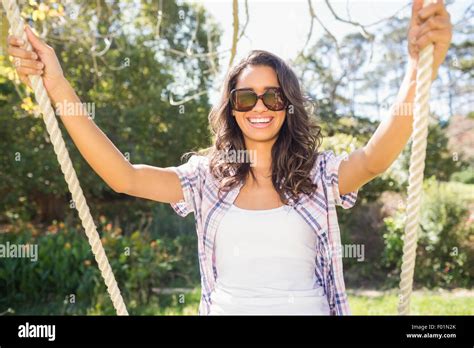 Pretty Brunette Swinging In Park Stock Photo Alamy