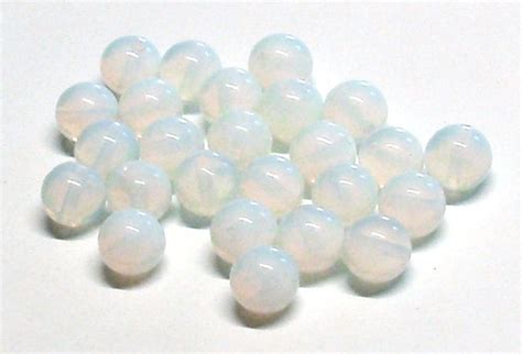 White Opalite Beads On A White Surface