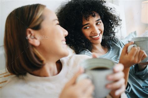 Coffee Happy And Lesbian Couple On Bed In Conversation For Bonding And Relaxing Together Smile