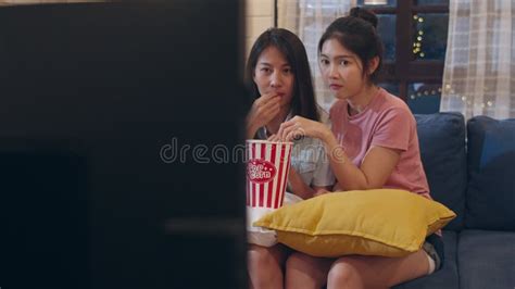 Lesbian Lgbt Women Couple Watching Movie At Home Asian Female Lover Eating Popcorn Scary And