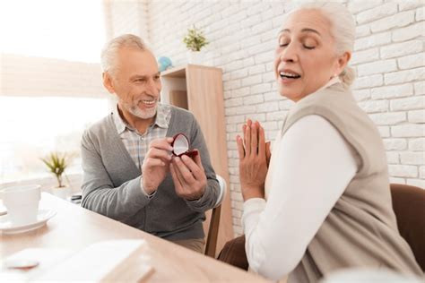 Premium Photo Mature Woman Admires Act Of Older Man