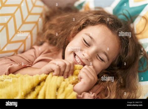 Adorable Caucasian Girl Lying On Sofa Sleeping At Home Stock Photo Alamy