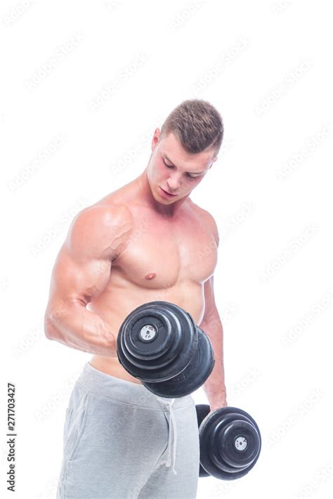 Powerful Bodybuilder Doing The Exercises With Dumbbells Photo Of Strong Male With Naked Torso