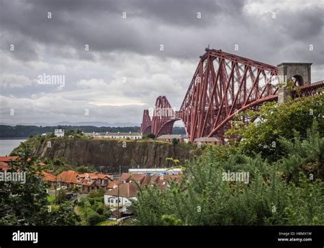 Homes Under The Forth Rail Bridge Stock Photo Alamy