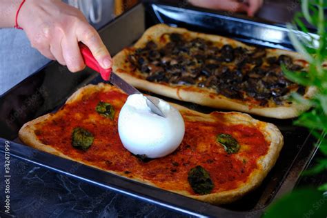 Preparing homemade italian pizza, homemade burrata pizza Stock Photo ...