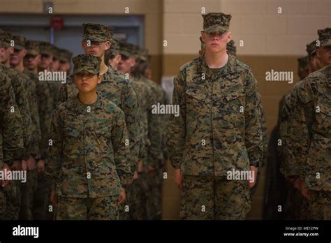 Pfc. Yolanda Vigil, left, stands in formation during her graduation ...