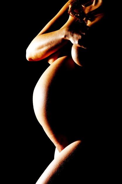 Premium Photo Naked Pregnant Woman Standing Against Black Background