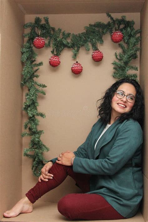 Latina 30 Year Old Woman With Glasses Inside A Cardboard Box Decorated As A Gift To Celebrate