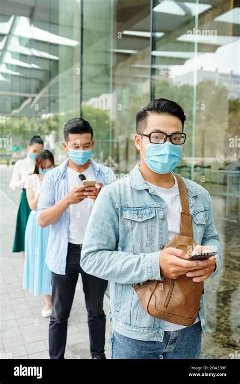 people standing  queue stock photo alamy
