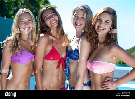 Portrait Of Beautiful Women In Bikini Standing Near The Pool Stock