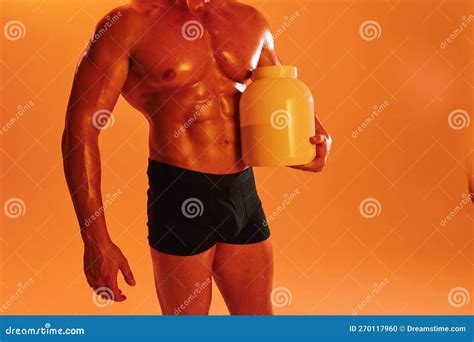 Man Bodybuilder Boxer With Naked Torso With Abs Holding Can Muscle Growth Pills Steroids