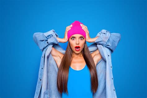 Close Up Portrait Of Shocked Face Of A Luxurious Brunette Girl With A Wide Open Mouth In Red