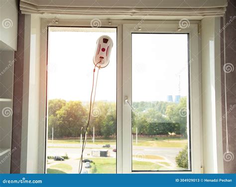 A Modern Device, a Vacuum Robot Window Cleaner, Cleans Glass from Dirt ...