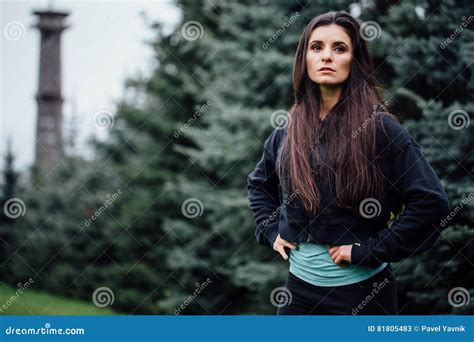 Beautiful Fitness Brunette Athlete Woman Resting Posing After Work Out Exercising At Park Stock