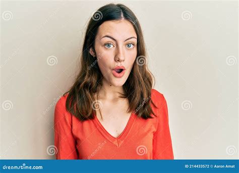 Young Brunette Woman Wearing Casual Clothes Afraid And Shocked With