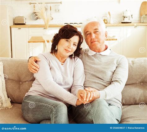 Mature Year Old Couple Hugging While Sitting On Sofa Love Forever Stock Image Image Of