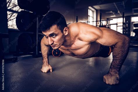 Fitness Man Performs Push Ups With Naked Torso Stock Photo Adobe Stock